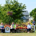 Linlithgow Rotary Club and a CALA Homes representative at the Rotary Club Planter outside the Queenswood development.Pictured: Michael McCormack, CALA assistant site manager and Joan Hale Club President with members Elma Birrell. Jim Rae, Harry Millar. Photo by Ian Georgeson.