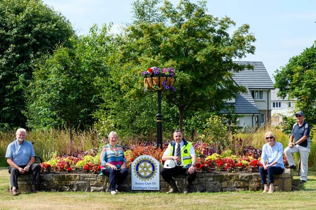 Linlithgow Rotary Club and a CALA Homes representative at the Rotary Club Planter outside the Queenswood development.Pictured: Michael McCormack, CALA assistant site manager and Joan Hale Club President with members Elma Birrell. Jim Rae, Harry Millar. Photo by Ian Georgeson.