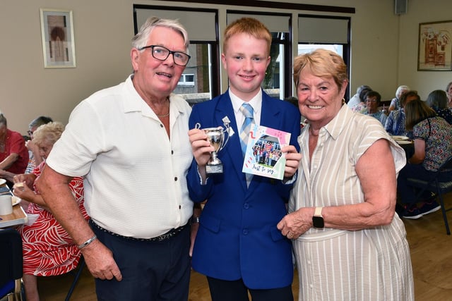 Archie Riddell, chairman and Helen Riddell secretary of Larbert and Stenhousemuir Age Concern presented volunteer Liam Landsman, an S5 pupil at Larbert High with a thank you for all he does for the group.