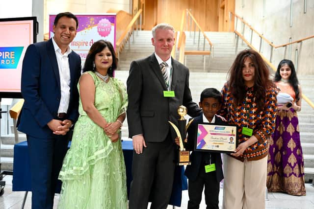 Whiz Kid award winner Jitendriya Dhinesh, a pupil at Kinnaird Primary, with Anas Sarwar, Dr Rashmi Mantri, judge Derek Timpany and Jade Dupont from category sponsor Dupont Associates.  (Pic: British Youth International College)