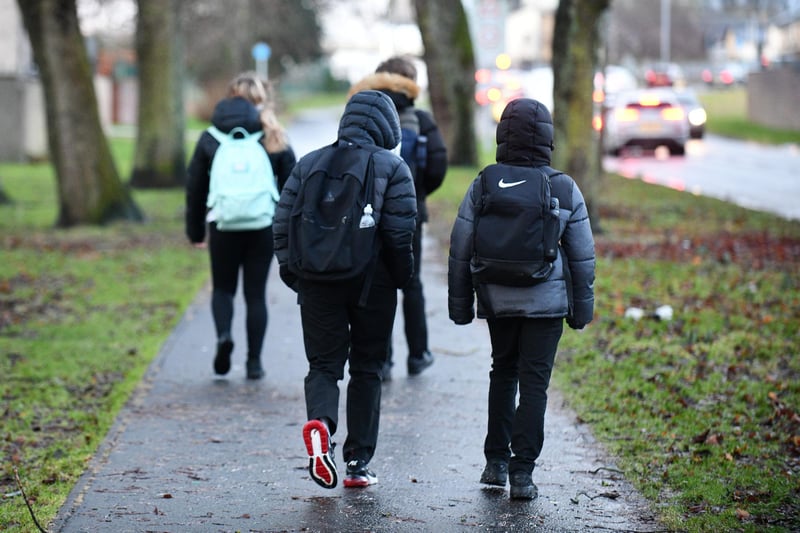 Pupils making their way to Falkirk High School. - only one primary school and one early years centre are currently closed.