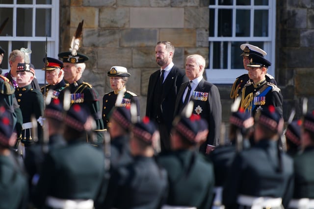 King Charles III (second left), the Princess Royal (centre), the Duke of York (second right) and the Earl of Wessex (right) watch as Queen Elizabeth II's coffin is removed from the Palace of Holyroodhouse at the start of the procession to St Giles' Cathedral, Edinburgh.