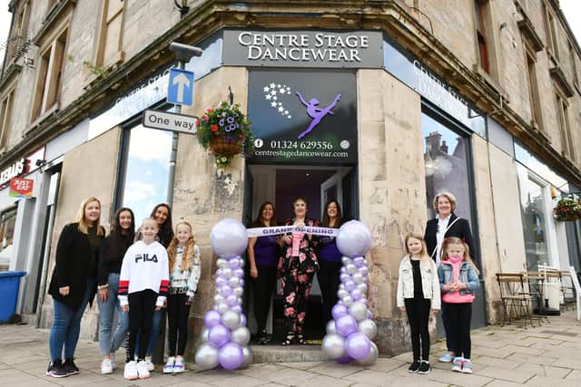 Centre Stage Dancewear owners Lesley Ann Craig and Leigh White watch on as Irene Langlands (centre), founder of Stenhouse School of Dance, opens the new shop in Falkirk. Picture: Michael Gillen.