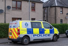 Police were still in Almond Street, Grangemouth, 24 hours after the man's death. Pic: Michael Gillen