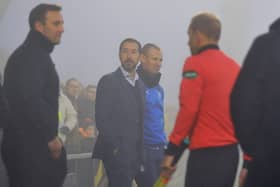 Falkirk head coach Martin Rennie watches on as the foggy conditions halt Saturday's match (Pic: Michael Gillen)