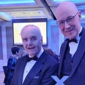 David Alexander receives his Lifetime Achievement Award from First Minister John Swinney. Pic: Contributed