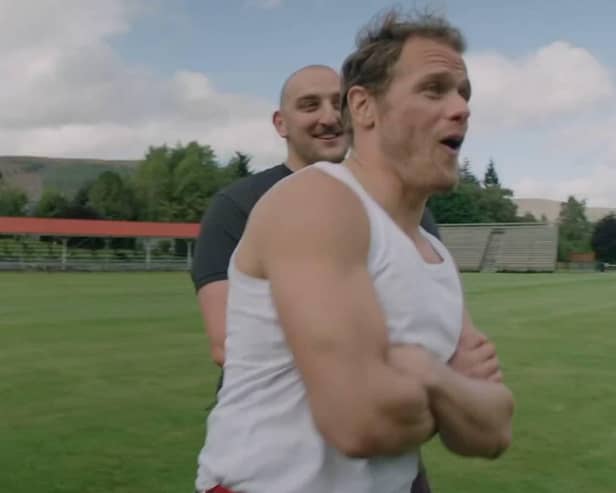 Local Highland Games competitor Kyle Randalls and actor Sam Heughan in "Men in Kilts"