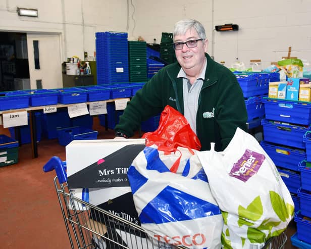Falkirk Food Bank chairman Alastair Blackstock and other volunteers are distributing hundreds of food parcels every week. Pic: Michael Gillen