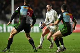 Fly-half Finn Russell  runs with the ball during the European Rugby Champions Cup pool A rugby union match between Harlequins and Racing 92 at the Twickenham Stoop Stadium (Photo by GLYN KIRK/AFP via Getty Images)