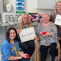 Hospital donation in memory of Helen Burness - left to right: Lorna Milligan, NHS Forth Valley palliative care clinical nurse specialist, Catherine Myhill, Helen Wright, Gillian Ryan and Morven Kellett, NHS Forth Valley advanced palliative care clinical nurse specialist