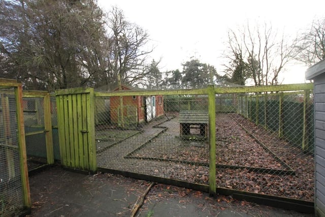 Outside the property has a large hen enclosure, paddock, stables and kennels.