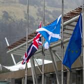 Stock photo of flags outside the Scottish Parliament in Edinburgh. PIC LISA FERGUSON  03/02/2021





Flags fly at half mast for Captain Sir Tom Moore who died yesterday at the age of 100.

The 100-year-old, who raised almost £33m for NHS charities by walking laps of his garden, died with coronavirus in Bedford Hospital on Tuesday.