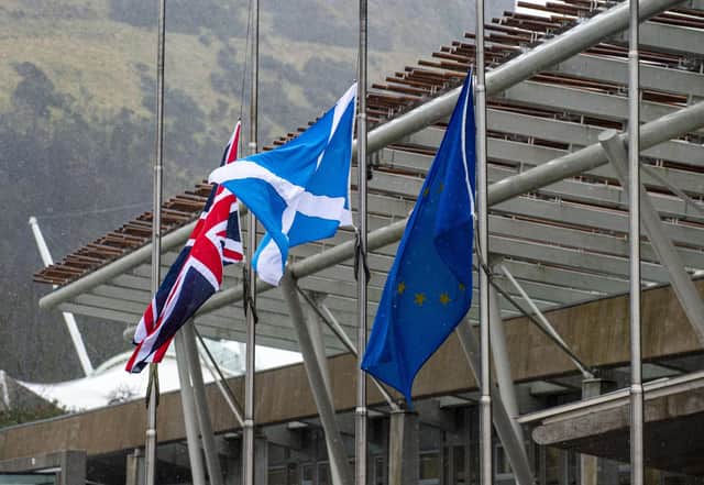 Stock photo of flags outside the Scottish Parliament in Edinburgh. PIC LISA FERGUSON 03/02/2021
Flags fly at half mast for Captain Sir Tom Moore who died yesterday at the age of 100.
The 100-year-old, who raised almost £33m for NHS charities by walking laps of his garden, died with coronavirus in Bedford Hospital on Tuesday.