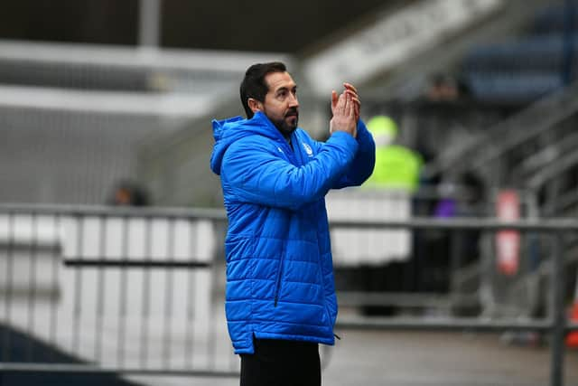 Martin Rennie applauds the Bairns support at the start of the match