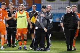 Syngenta boss Gordon Wylde (black cap) and his team enjoy the moment after sealing a place in the Scottish Cup first round for the first time (Photos: Michael Gillen)