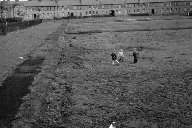 Children play on derelict land in Oxgangs in 1964.