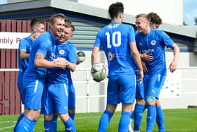 Striker Scott Dalziel is mobbed his Bo’ness United teammates after putting the BU two goals up against Tranent Juniors on Saturday in the Lowland League (Pictures: Turnstiles and Terraces)