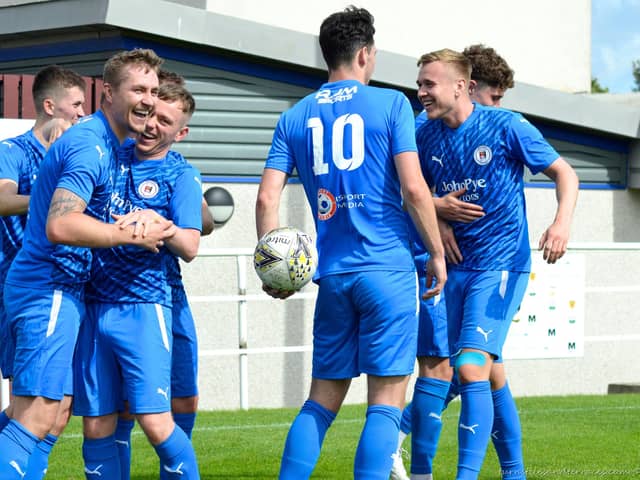 Striker Scott Dalziel is mobbed his Bo’ness United teammates after putting the BU two goals up against Tranent Juniors on Saturday in the Lowland League (Pictures: Turnstiles and Terraces)