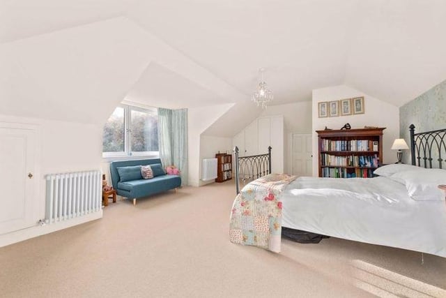This spacious top-floor bedroom is beautifully decorated and has its own en-suite too.