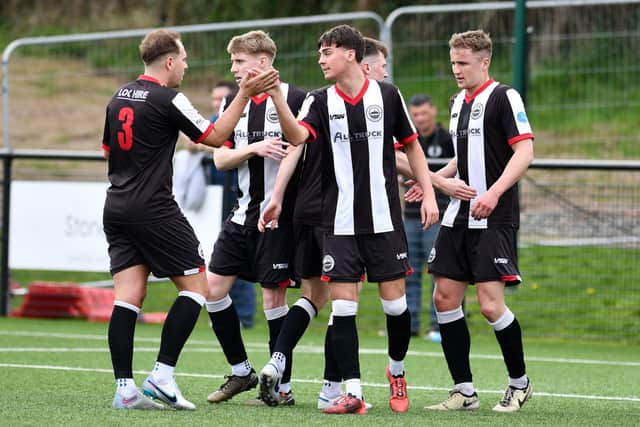 Kai Wilson celebrates his strike against Edinburgh Uni with his Dunipace team-mates (Photo: Michael Gillen)