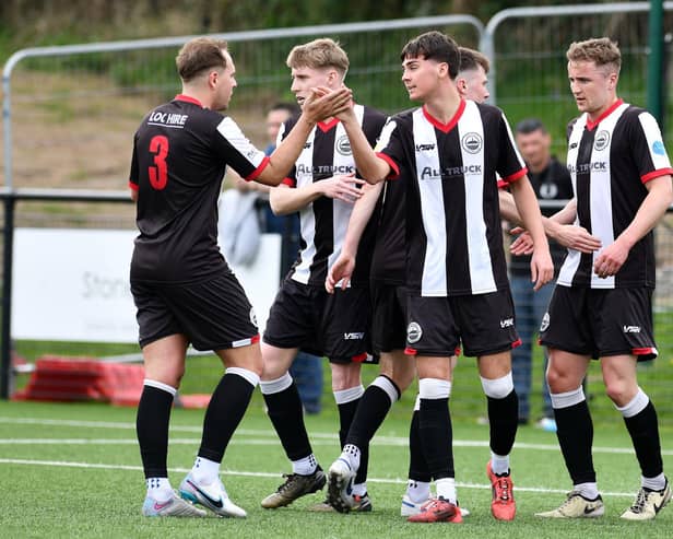 Kai Wilson celebrates his strike against Edinburgh Uni with his Dunipace team-mates (Photo: Michael Gillen)