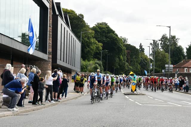 The main pack of competitors come along Camelon Road. Pic: Michael Gillen