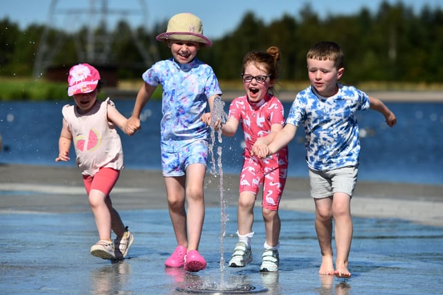 This looks lots of fun. Lillie Rickard, four, Flora Douglas, four, Daisy Coyne, seven, and Alfie Coyne, five, certainly look to be enjoying themselves and keeping cool.