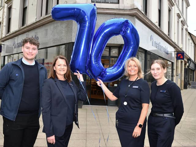 The Nationwide team have celebrated 70 years in Falkirk. From left, Rhys Campbell, Member Representative; Michele Neagle, Senior Branch Manager;  Annemarie Beattie, Member Relationship Manager and Erin McIntyre, Member Representative.   (pic: Michael Gillen)