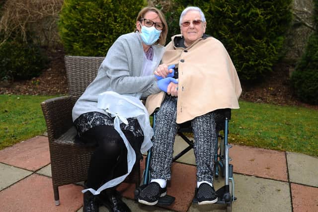 Anne Lake visiting her mum Lily Waugh at Carrondale Care Home, Carron. Photographs taken outside as only essential visitors are permitted inside. Picture: Michael Gillen.