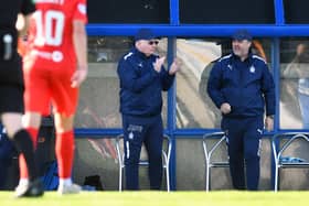Boss John McGlynn and Paul Smith on the touchline
