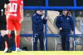 Boss John McGlynn and Paul Smith on the touchline