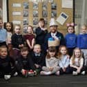 Duncan Currie, site manager at Miller Homes Antonine Brae with Grange Primary children. Pic. Contributed
