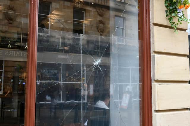 The damage done to the pane of glasgow at Johnston's Bar Bistro in Falkirk. Picture: Michael Gillen.