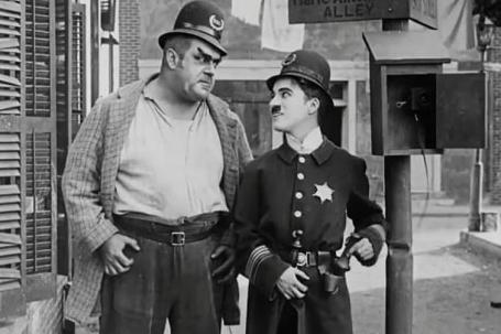 Charlie Chaplin in big trouble in Easy Street (1917)