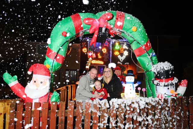 Banknock residents Laura Acheson and partner Steven Graham 33 set up a Christmas display every year for their son, Tommy Graham (7), which is now supporting the work of Strathcarron Hospice. Picture: Michael Gillen.
