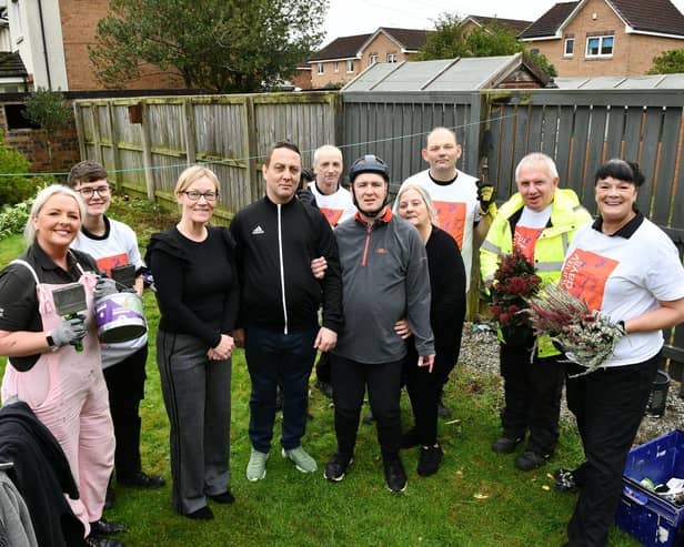 The garden of Martin Wotherspoon, centre, getting a makeover thanks to B&Q Falkirk colleagues. Pic: Michael Gillen