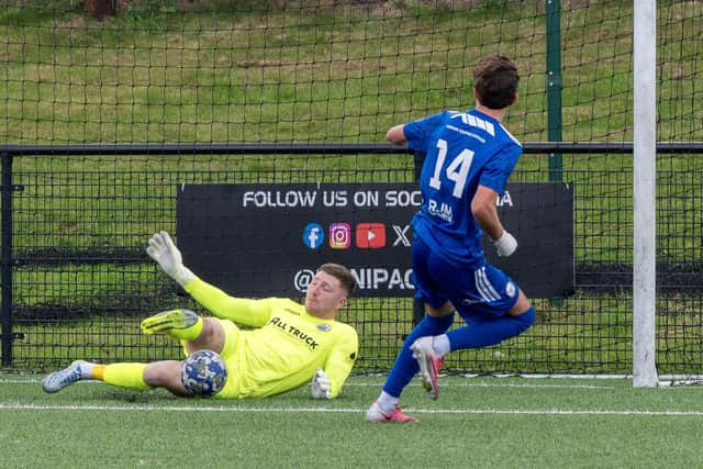 East Stirlingshire attacker Kai Wilson scores on the rebound to net his second of the afternoon against Dunipace (Photo: Michael Gillen)