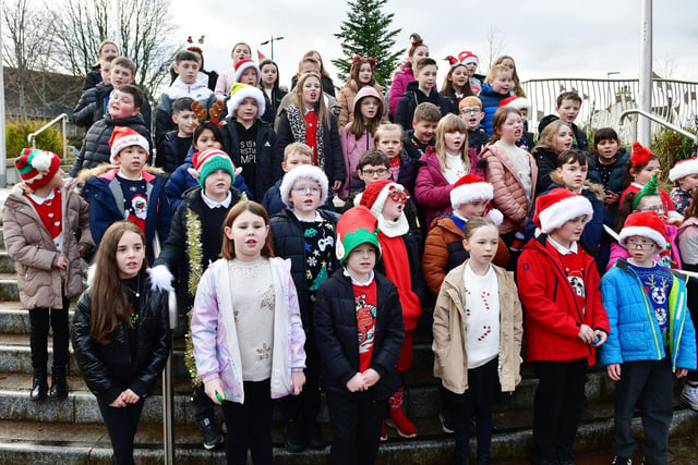 The pupils entertained passers-by and shoppers with their festive offering.
