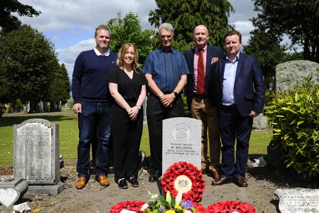 Private Michael Muldoon's relatives Laura Russell and Alan McCann, along with those from the Without Fear Project Robert Jardine, Alan Gow and Richard Hannah.