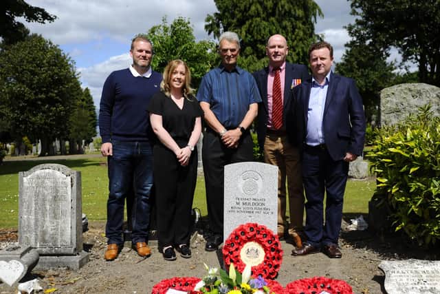 Private Michael Muldoon's relatives Laura Russell and Alan McCann, along with those from the Without Fear Project Robert Jardine, Alan Gow and Richard Hannah.