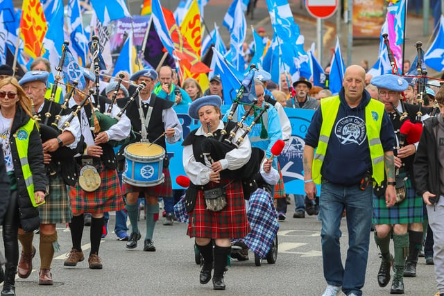 A pipe band led the march through the heart of the historic town.