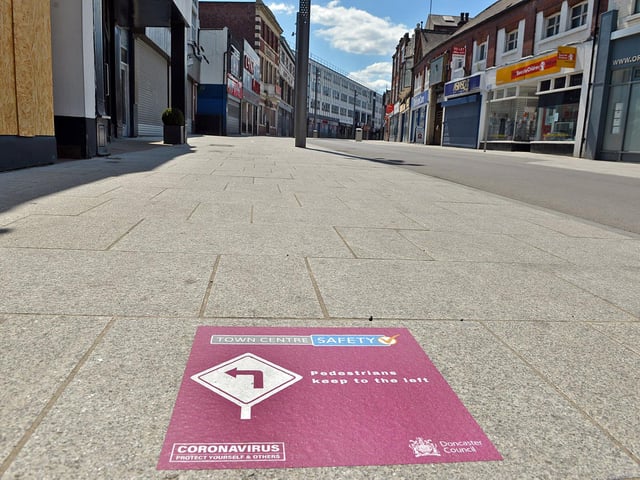 Doncaster town centre is being marked out with for social distancing signs like this one on Silver street.