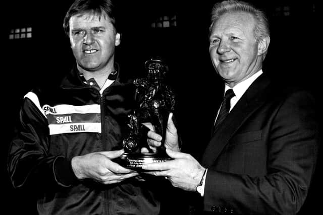 Holmes giving then-boss Jefferies with the Tartan Special Manager of the Month award for December 1990 (Photo: SNS Group)