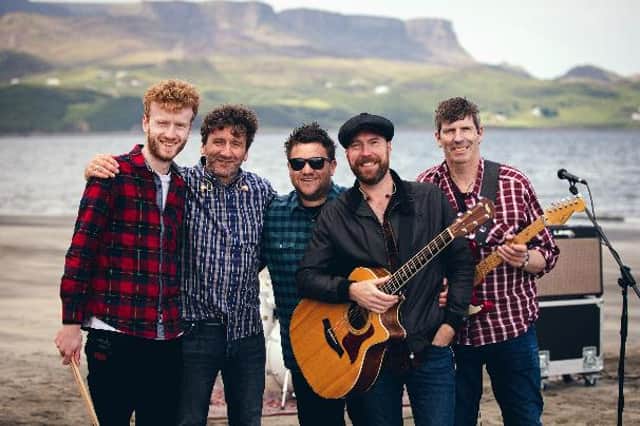 New Runrig tribute band Beat The Drum, with South Queensferry lead singer Richie Muir (wearing hat), at Staffin Bay, Skye.