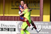 Stenny goalkeeper Darren Jamieson celebrates with Ross Meechan after shootout win (Pic Michael Gillen)