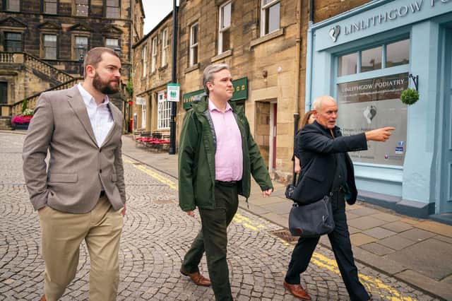 Pictured: Community Wealth Minister Tom Arthur (centre) speaks with Eddie Linton-Smith (Manager One Linlithgow) (left) and Phil Prentice (Scotland’s Towns Partnership (STP) Chief Officer) (right) during a visit to Linlithgow.