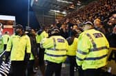 27-12-2024. Picture Michael Gillen. DUNFERMLINE. East End Park. Dunfermline Athletic FC v Falkirk FC. Season 2024 - 2025. SPFL William Hill Championship. Match Day 19. Falkirk fans being watched by Police Scotland and security staff.