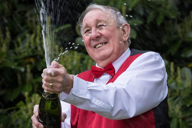 John Wallman celebrates his £1 million Lottery win