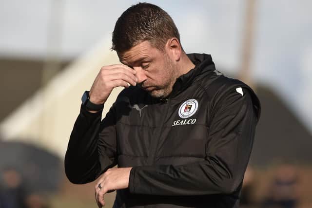 Bo'ness United manager Stuart Hunter feels the pain during Saturday's defeat to Cumbernauld United (Pics by Alan Murray)