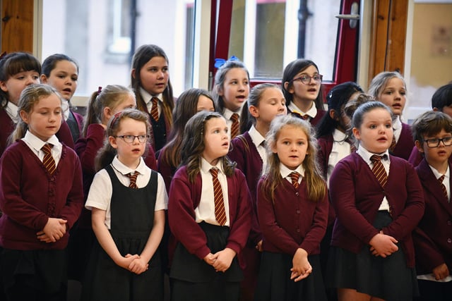 The school choir sings for pupils and invited guests during the mass.